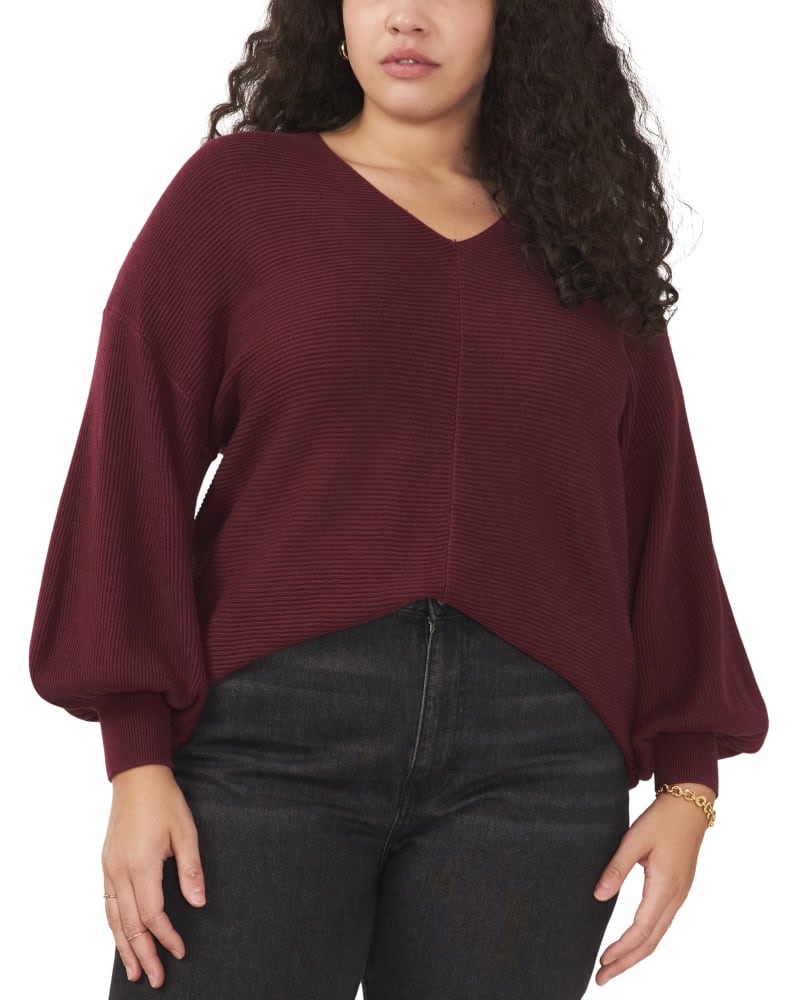 Front of a model wearing a size 0X Harlow Bubble Sleeve Sweater in WINDSOR WINE by 1.State. | dia_product_style_image_id:262617